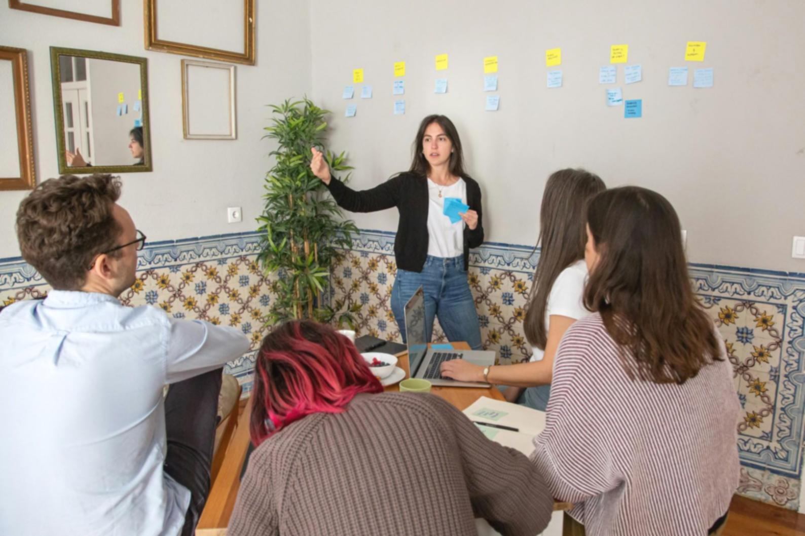 Financial professionals collaborating on model development in a modern learning environment